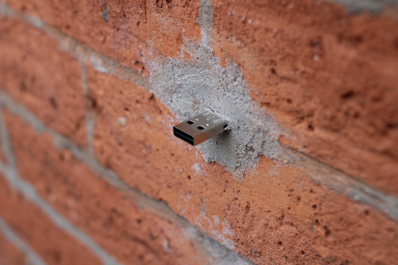 Detail of USB flash disk cemented to the wall